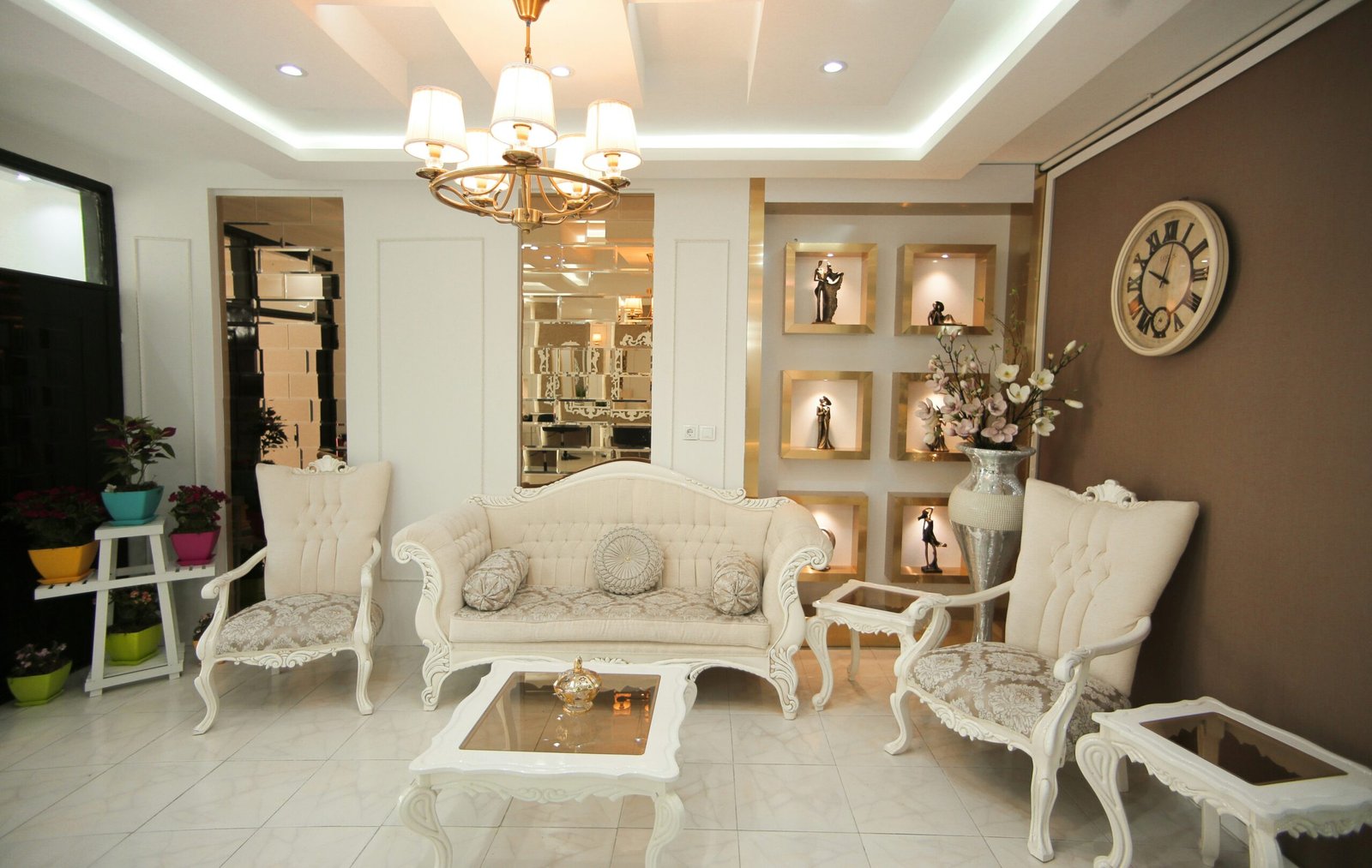 a living room filled with furniture and a chandelier